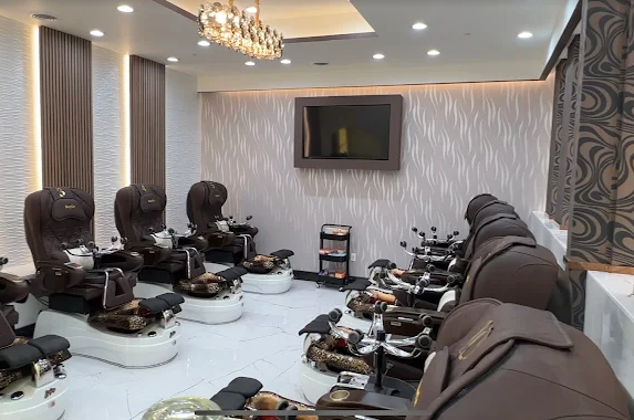 Private pedicure suite with textured feature wall and chandelier
